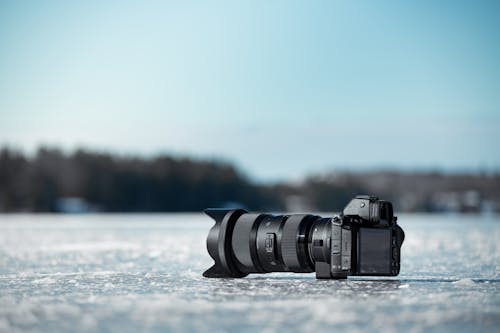 Camera Lying on Frozen Lake 