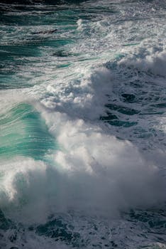 A dramatic capture of ocean waves crashing fervently with foam and spray.