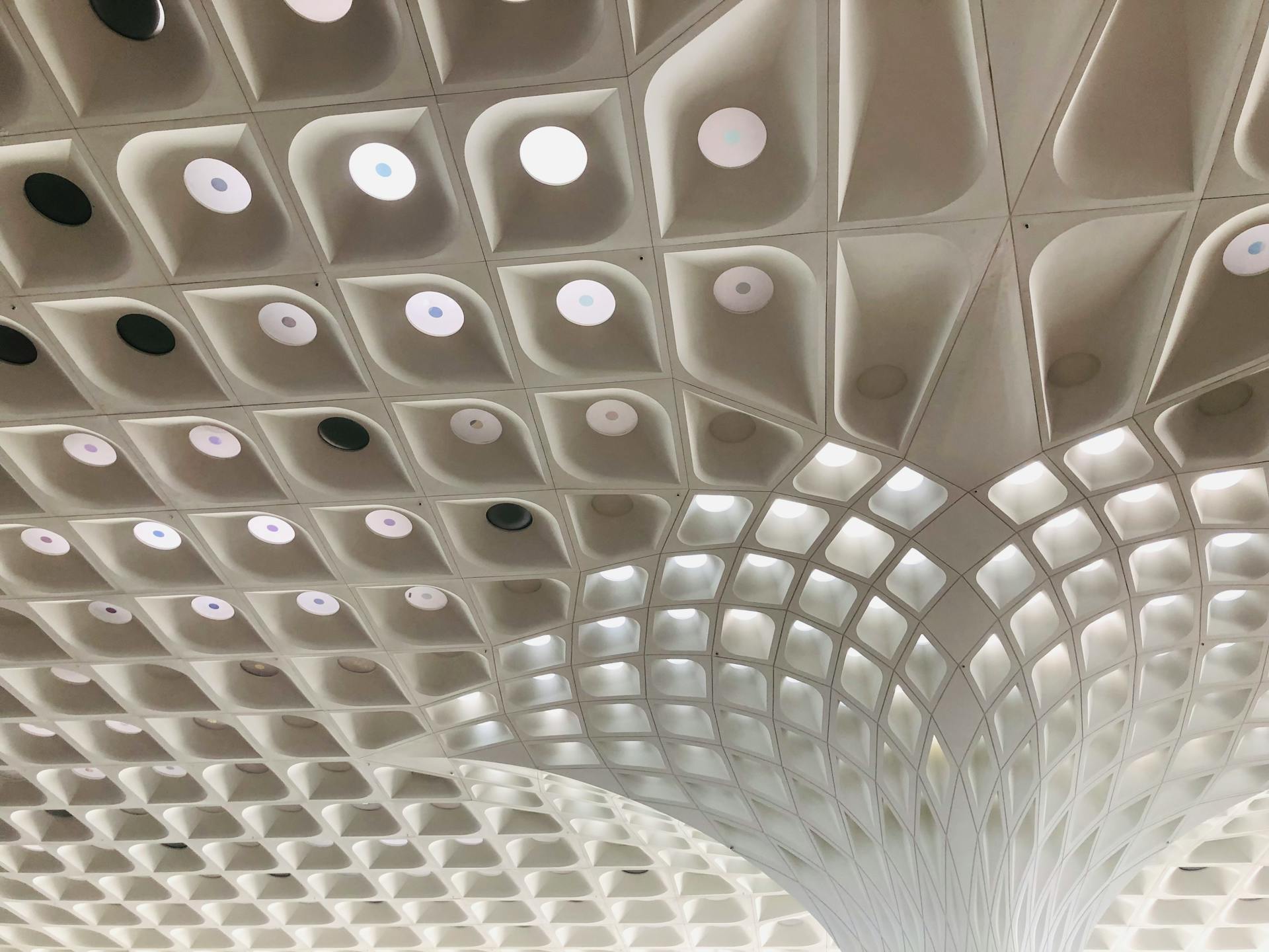 Geometric ceiling design at Mumbai airport showcasing modern architecture.