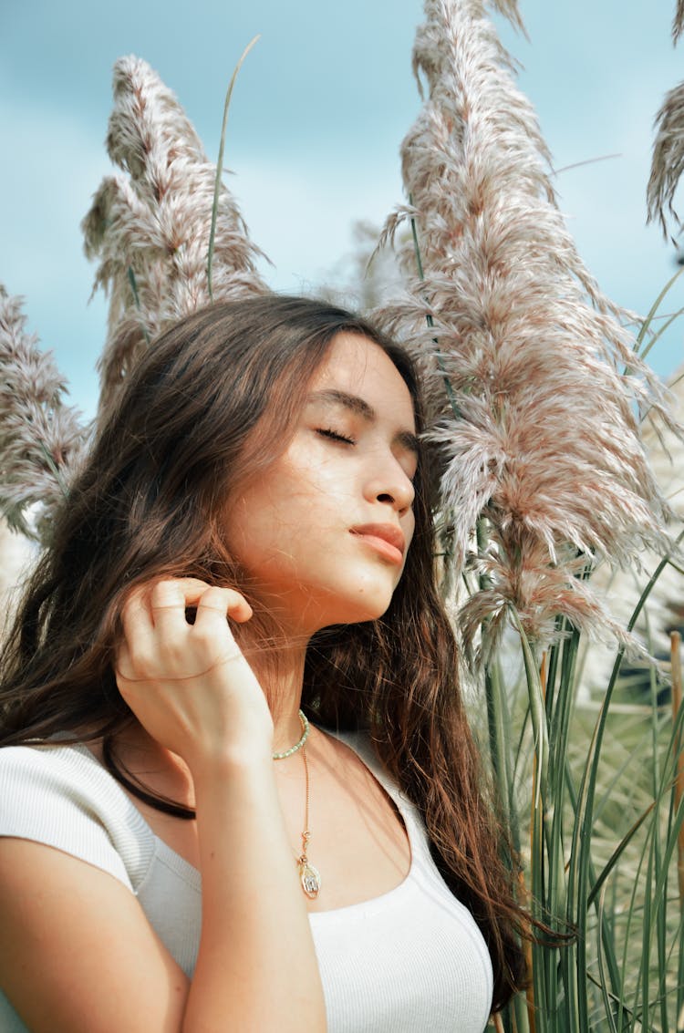 Portrait Of Woman Standing In Field Of Pampas Grass