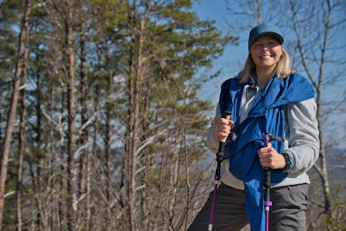 Smiling Blonde with Trekking Poles