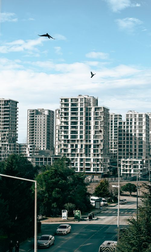 Free Captivating view of high-rise buildings in Istanbul, showcasing urban architecture under a clear blue sky. Stock Photo