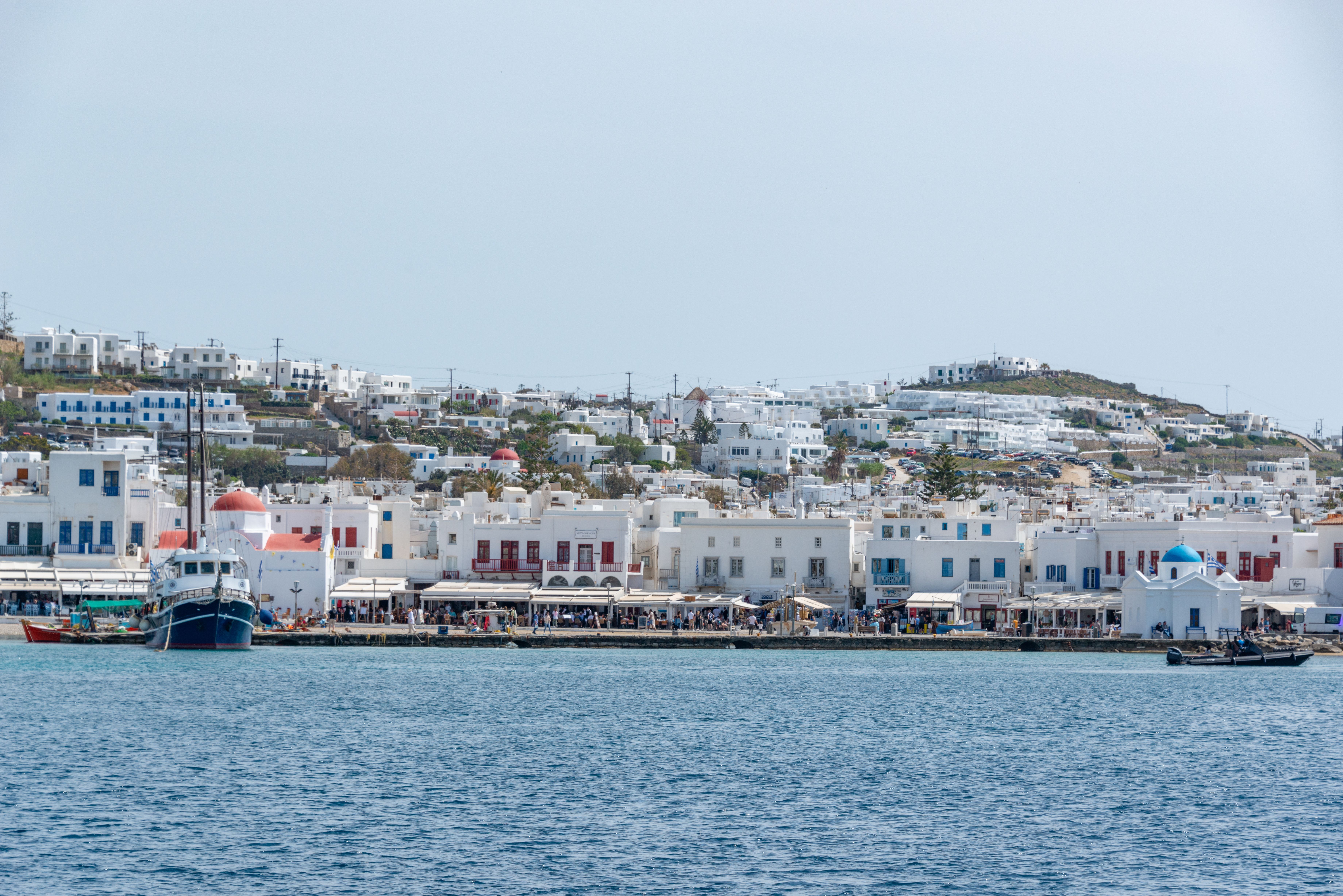 Free Discover the iconic whitewashed architecture along the Mykonos waterfront, captured on a sunny day. Stock Photo