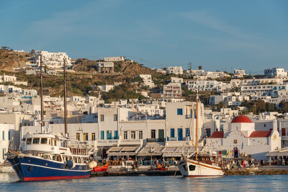 Best Athens Cruise: Agistri, Moni/Metopi, Aegina with Lunch & Drinks Review 2026 - Picturesque harbor with boats and traditional Greek architecture under sunny skies.