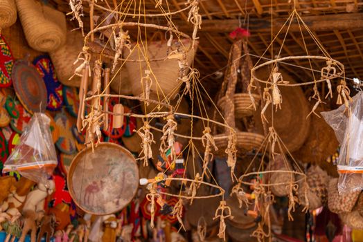 Vibrant and detailed shot of handmade crafts and ornaments displayed at a traditional market stall.