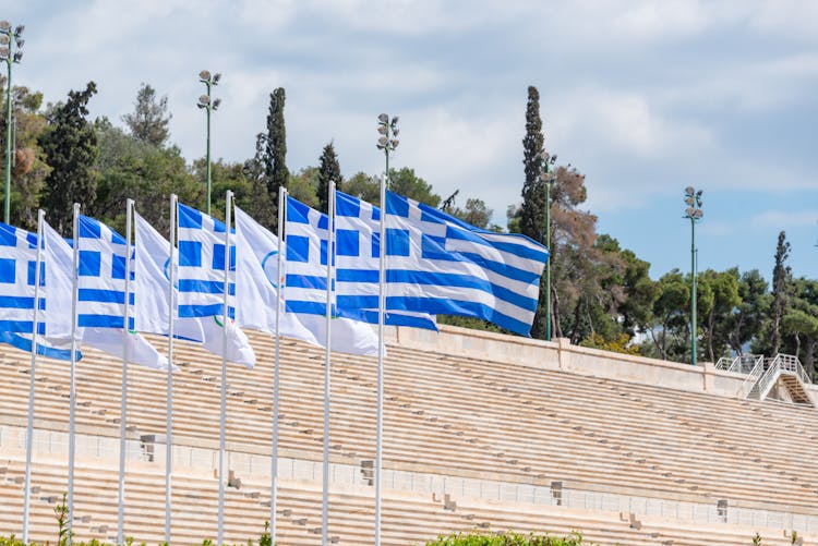 Photo Of Greek National Flags On A Stadium