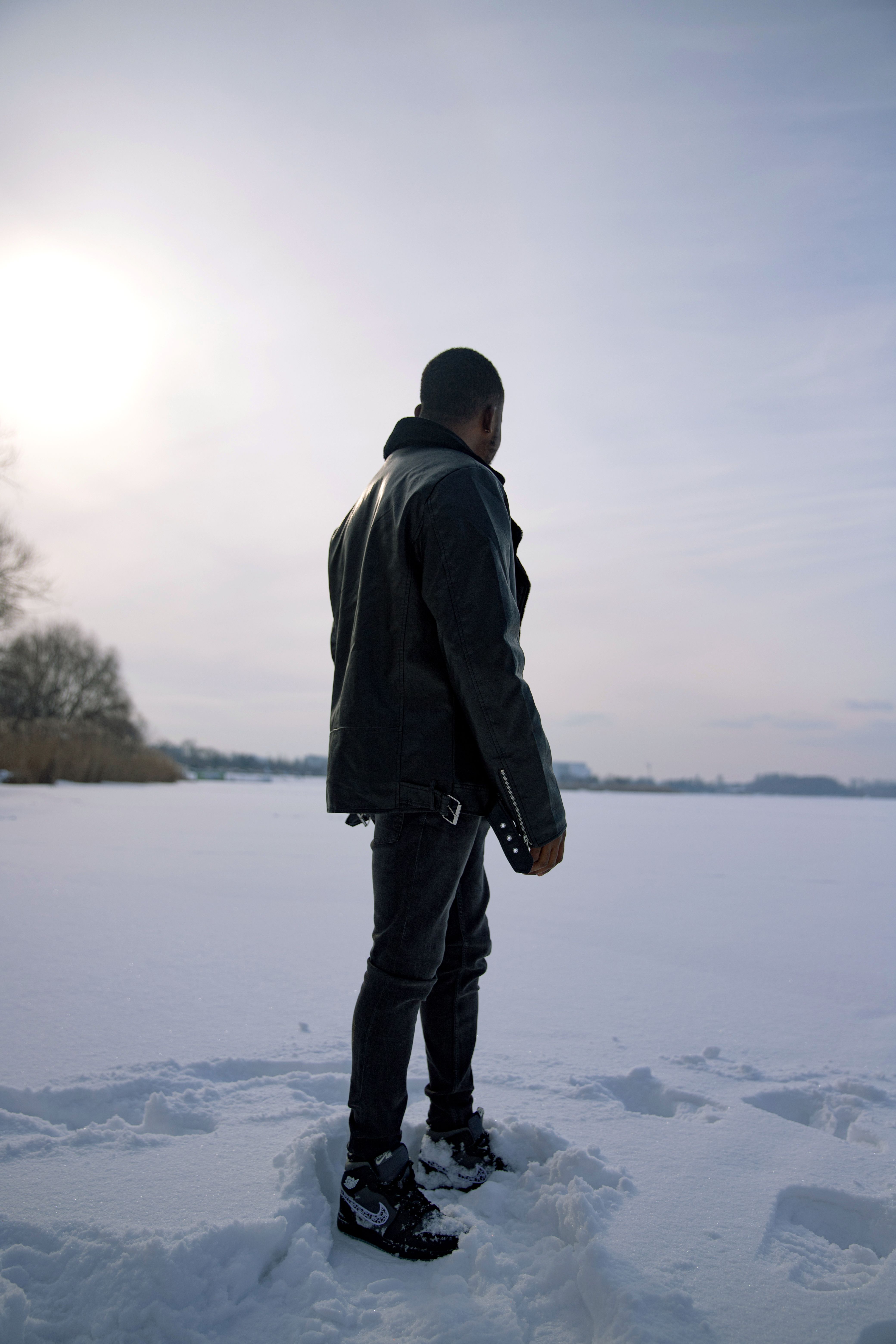 Man Standing in the Snow Covered Field · Free Stock Photo