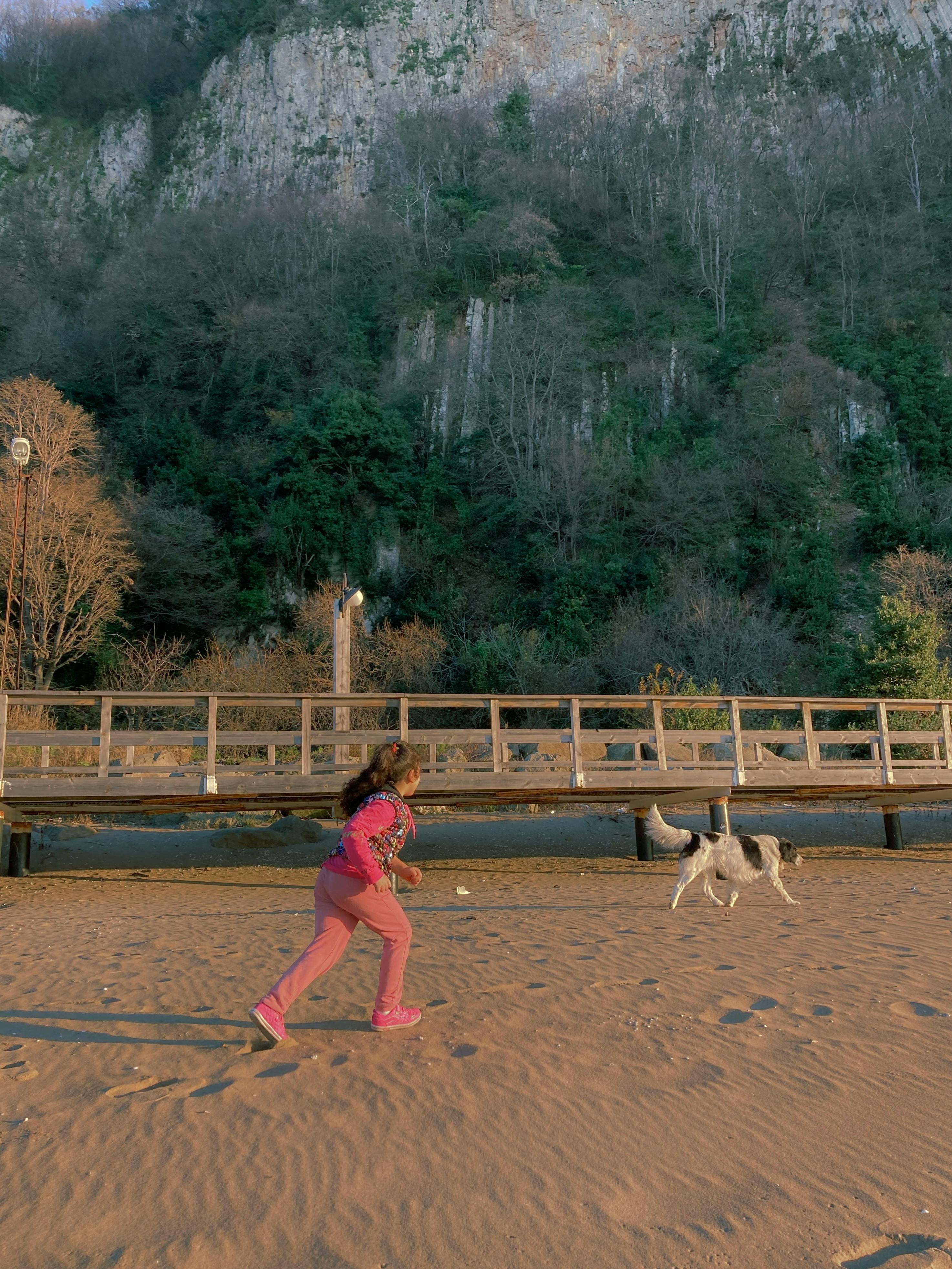 girl playing with dog