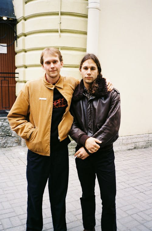 Men Standing on Sidewalk