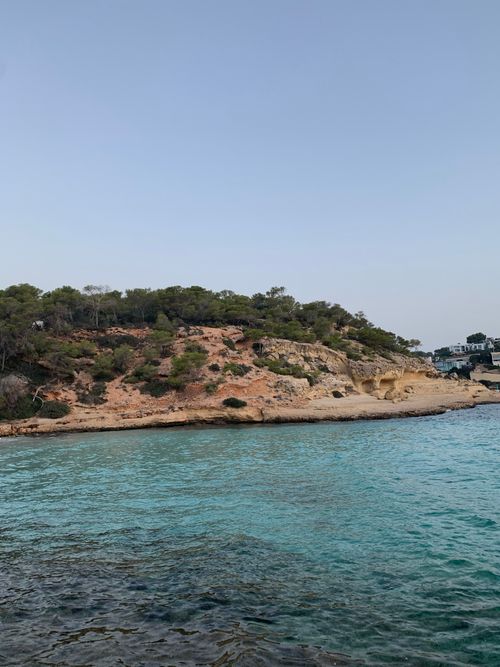 Free Explore the stunning rocky coastline and turquoise waters of Ibiza with this vibrant seascape. Stock Photo