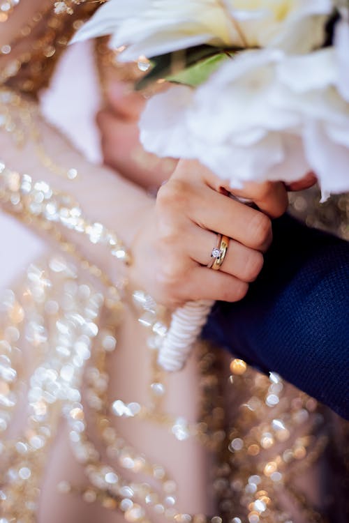 Free A Person Wearing Gold Wedding Ring Stock Photo