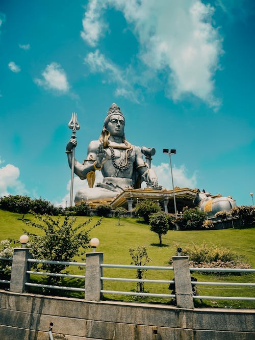 Shiva Statue in a Park Under Blue Sky