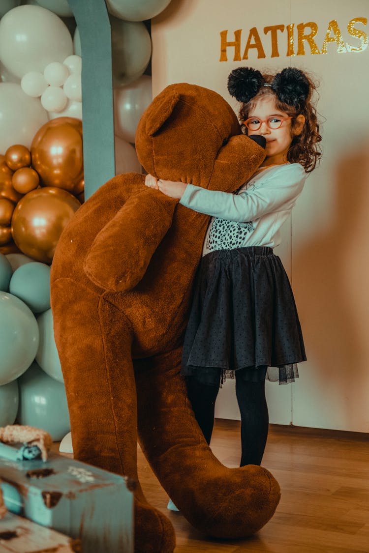 Girl Holding A Teddy Bear