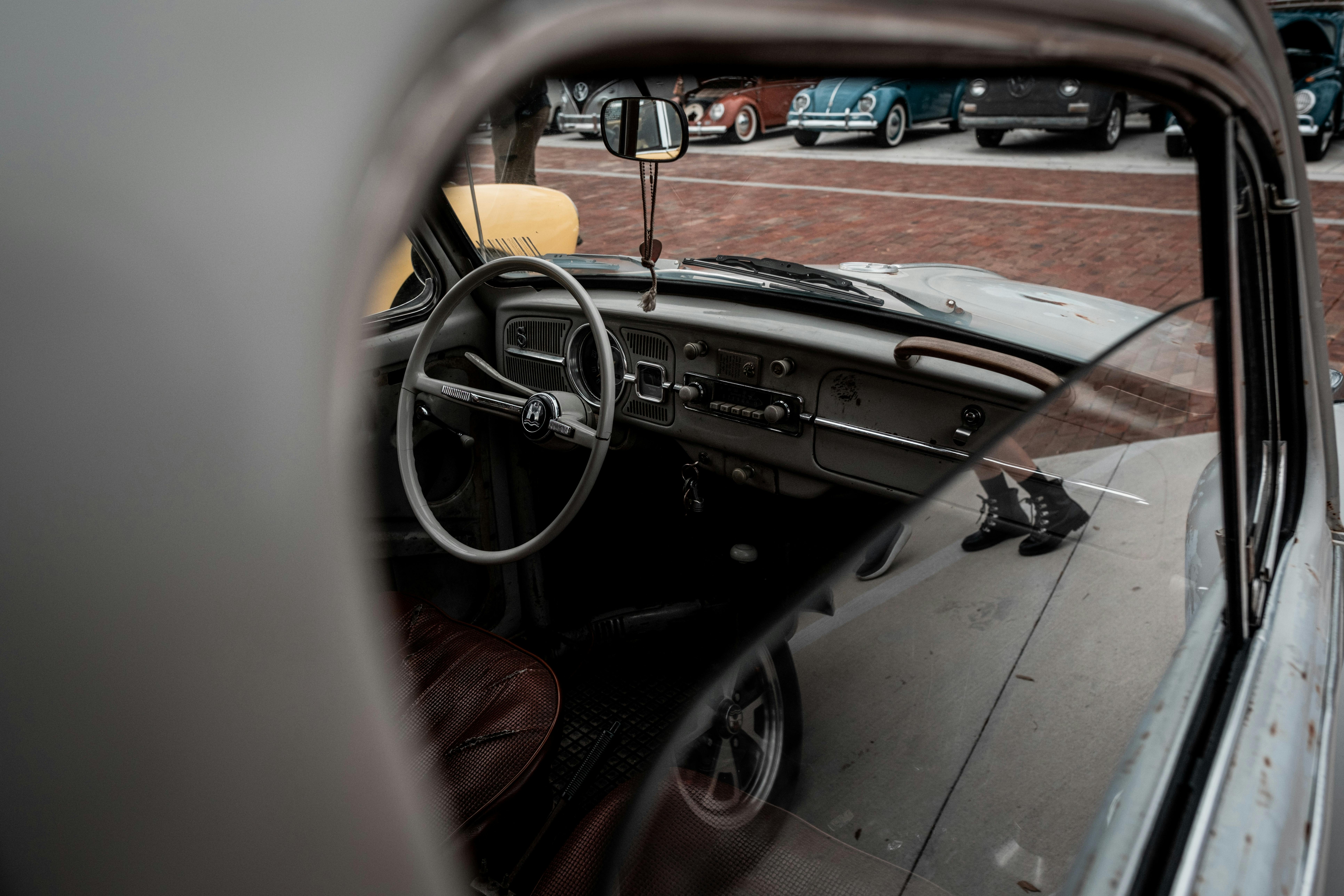 steering wheel and dashboard of an old volkswagen beetle
