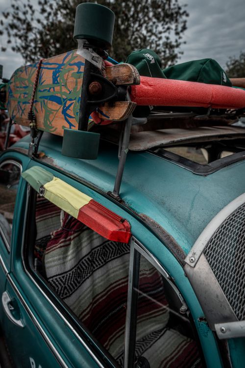 Free Close-up of a vintage Volkswagen with skateboard and gear, perfect for a nostalgic travel vibe. Stock Photo