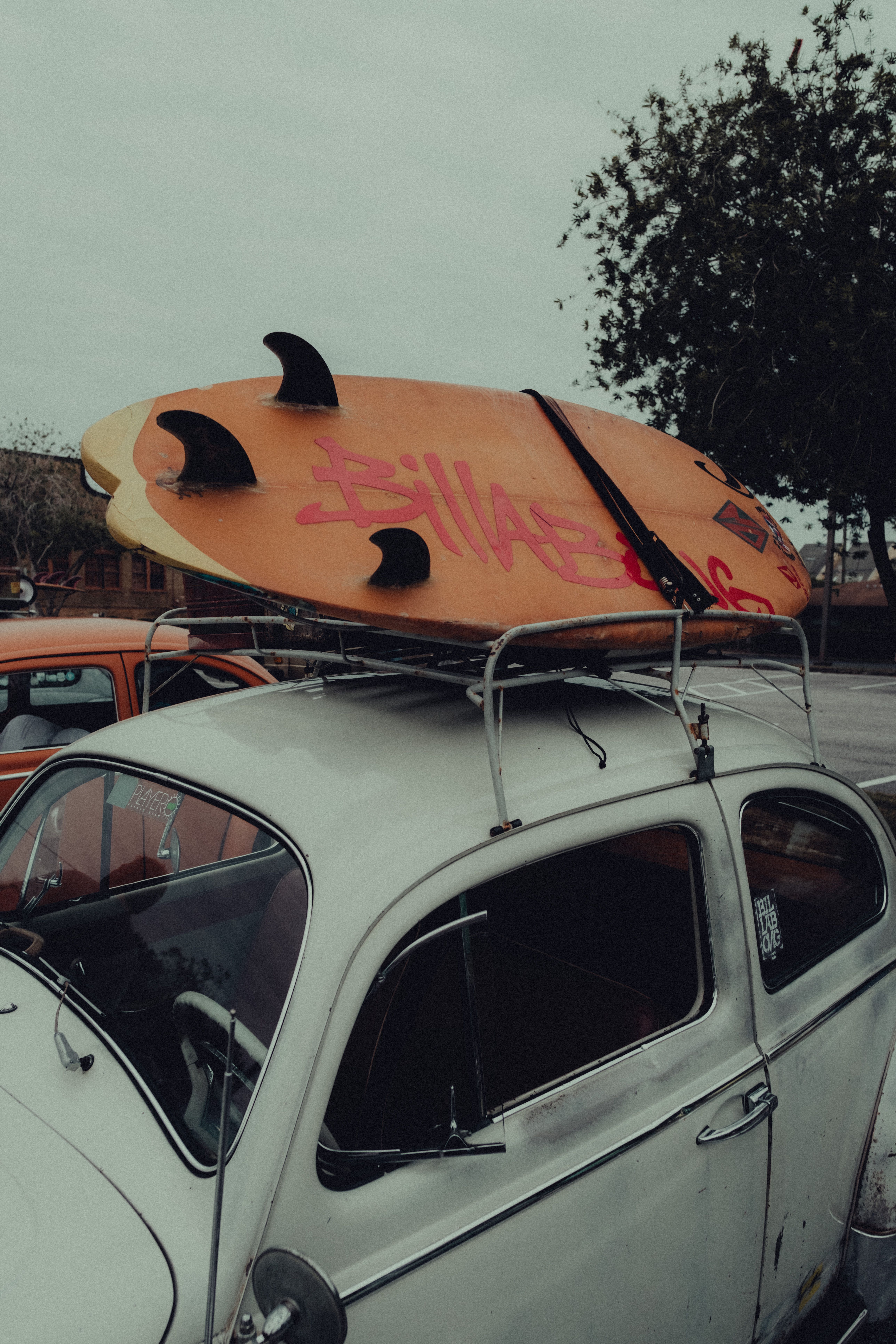 Surfboard on the Roof Rack of a White Volkswagen Beetle Type 1 · Free ...