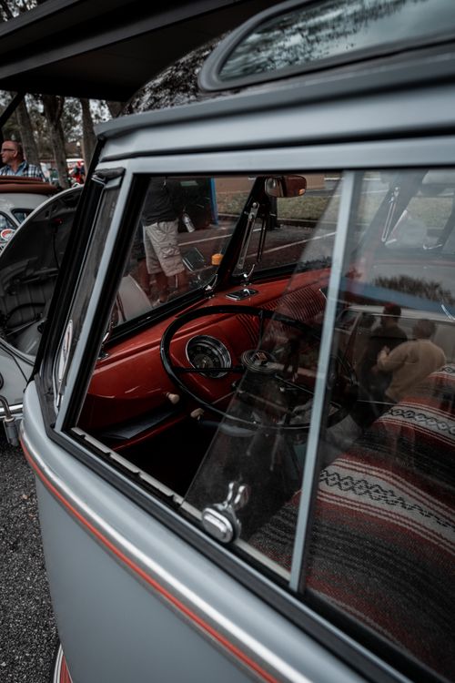 Free Detailed interior view of a classic Volkswagen minivan with an open side window, showcasing nostalgia. Stock Photo