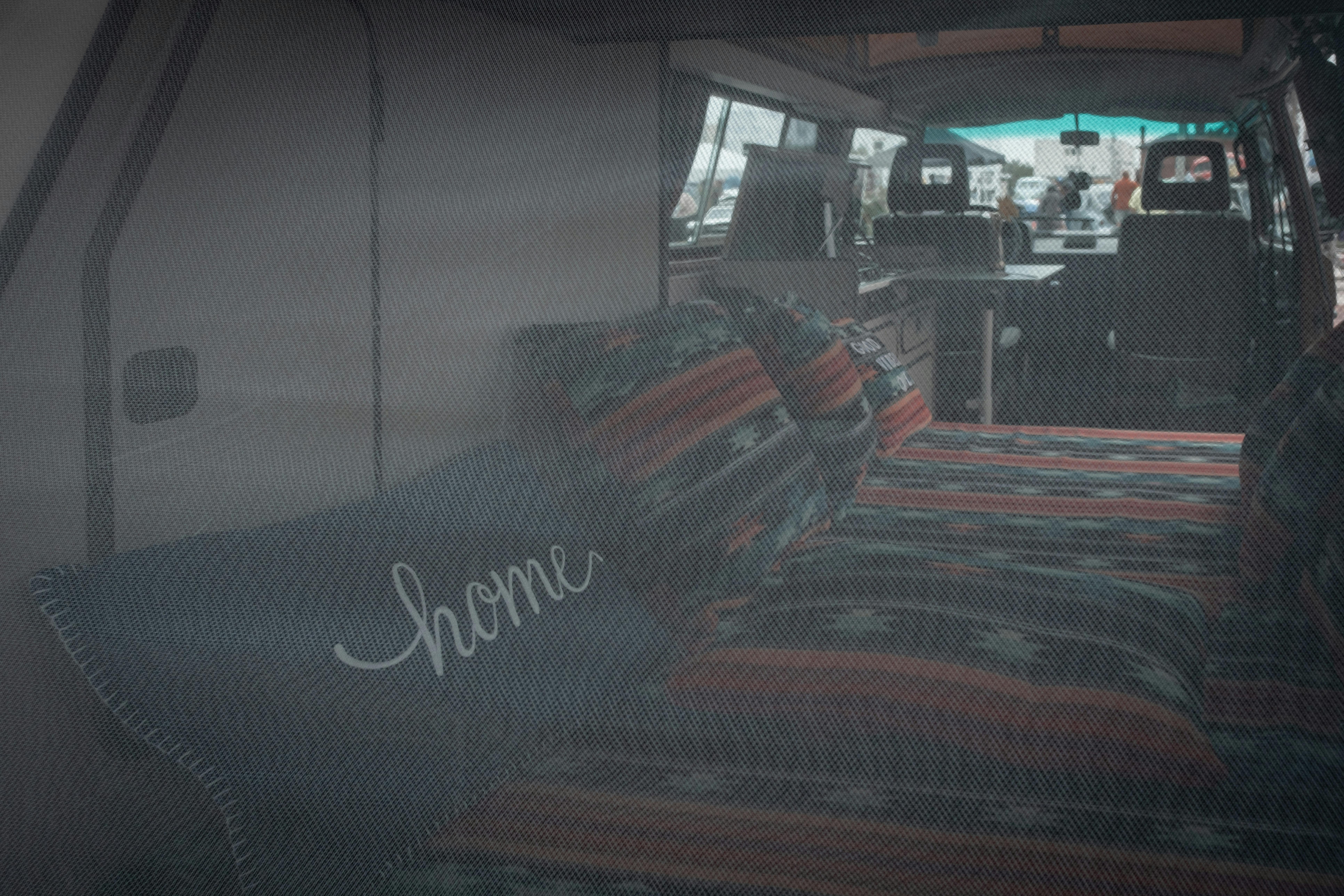 Comfortable bed inside a vintage camper van, perfect for road trips.