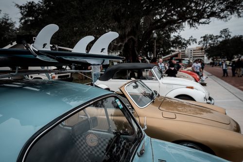 Free A lineup of classic Volkswagen cars at an outdoor vintage car event. Perfect for enthusiasts. Stock Photo