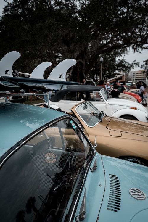 Free A lineup of classic vintage cars parked outdoors, showcasing retro styles. Stock Photo