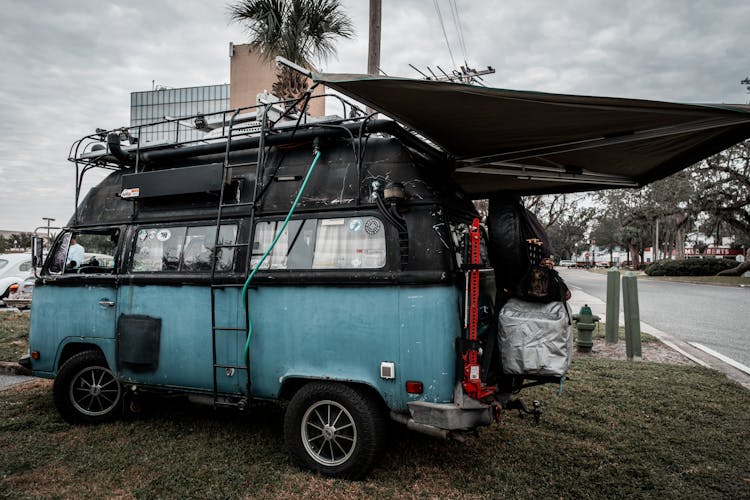 A Blue And Black Volkswagen Transporter