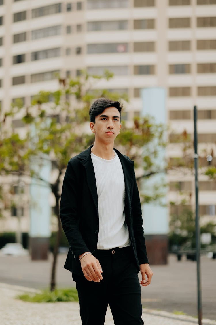 Stylish Man Walking On City Street