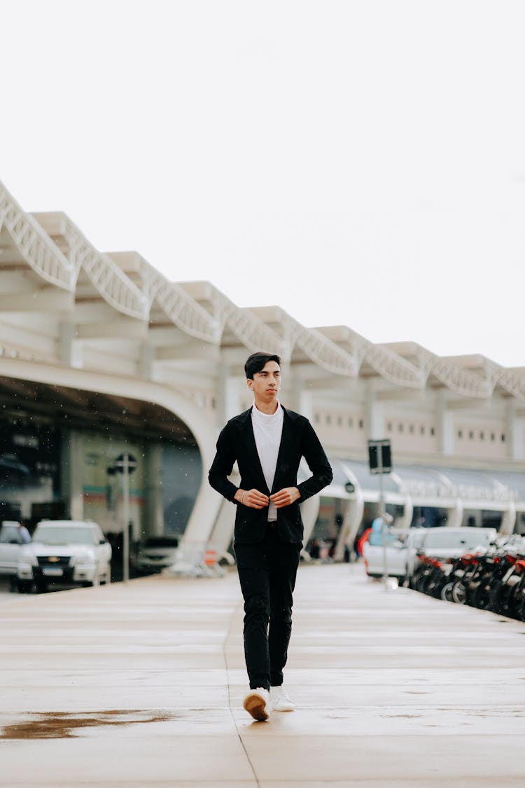 Stylish Man In Suit Walking Near Stadium