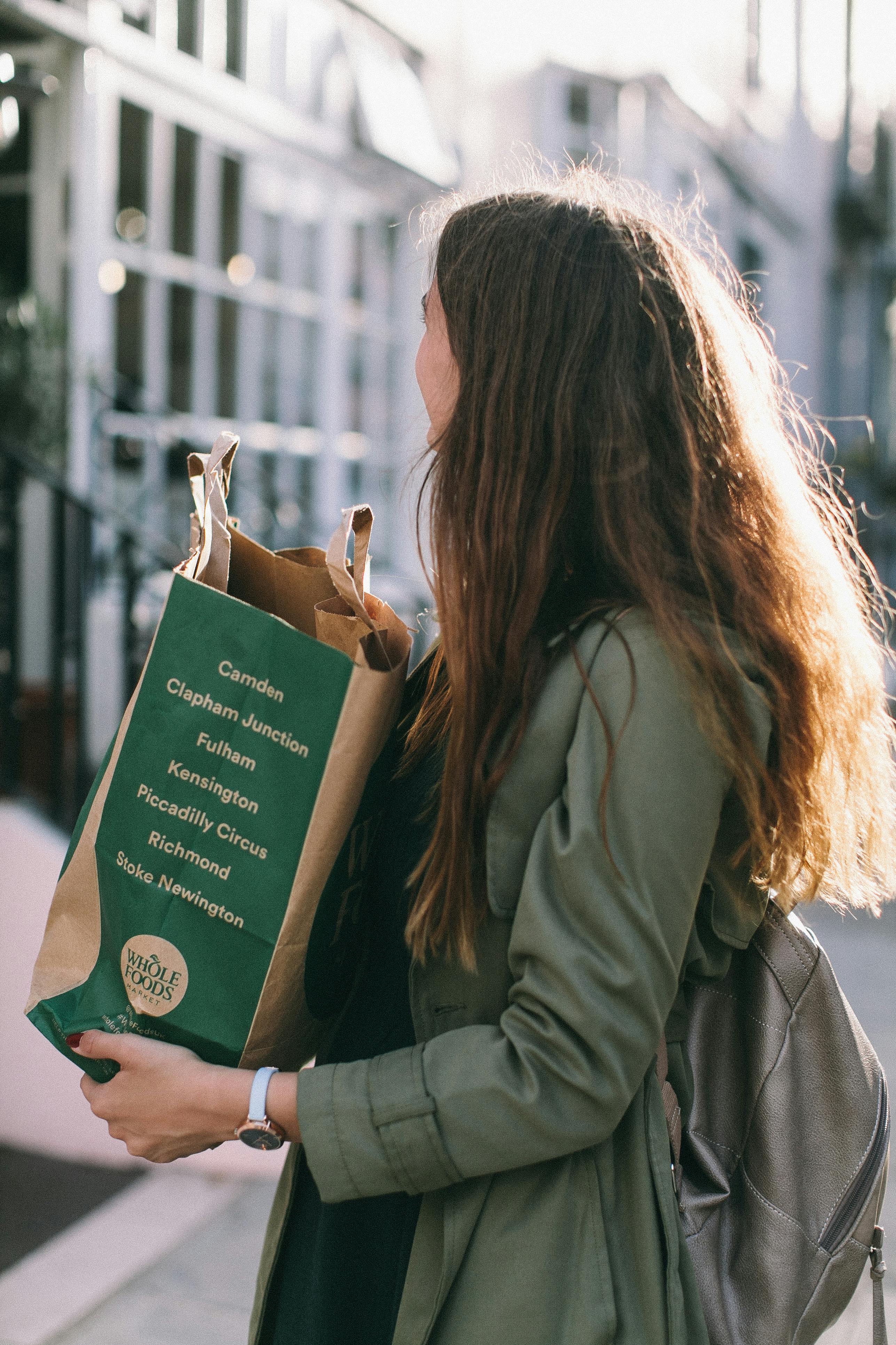 woman carrying paper bag