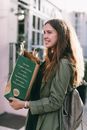 Woman Carrying Paper Bag