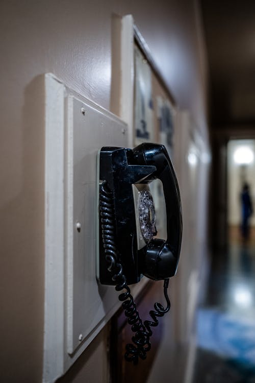 Telephone Handset on Wall at Night