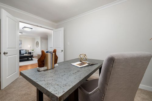 Free Contemporary home office setup featuring stylish furniture and decor elements for a productive environment. Stock Photo