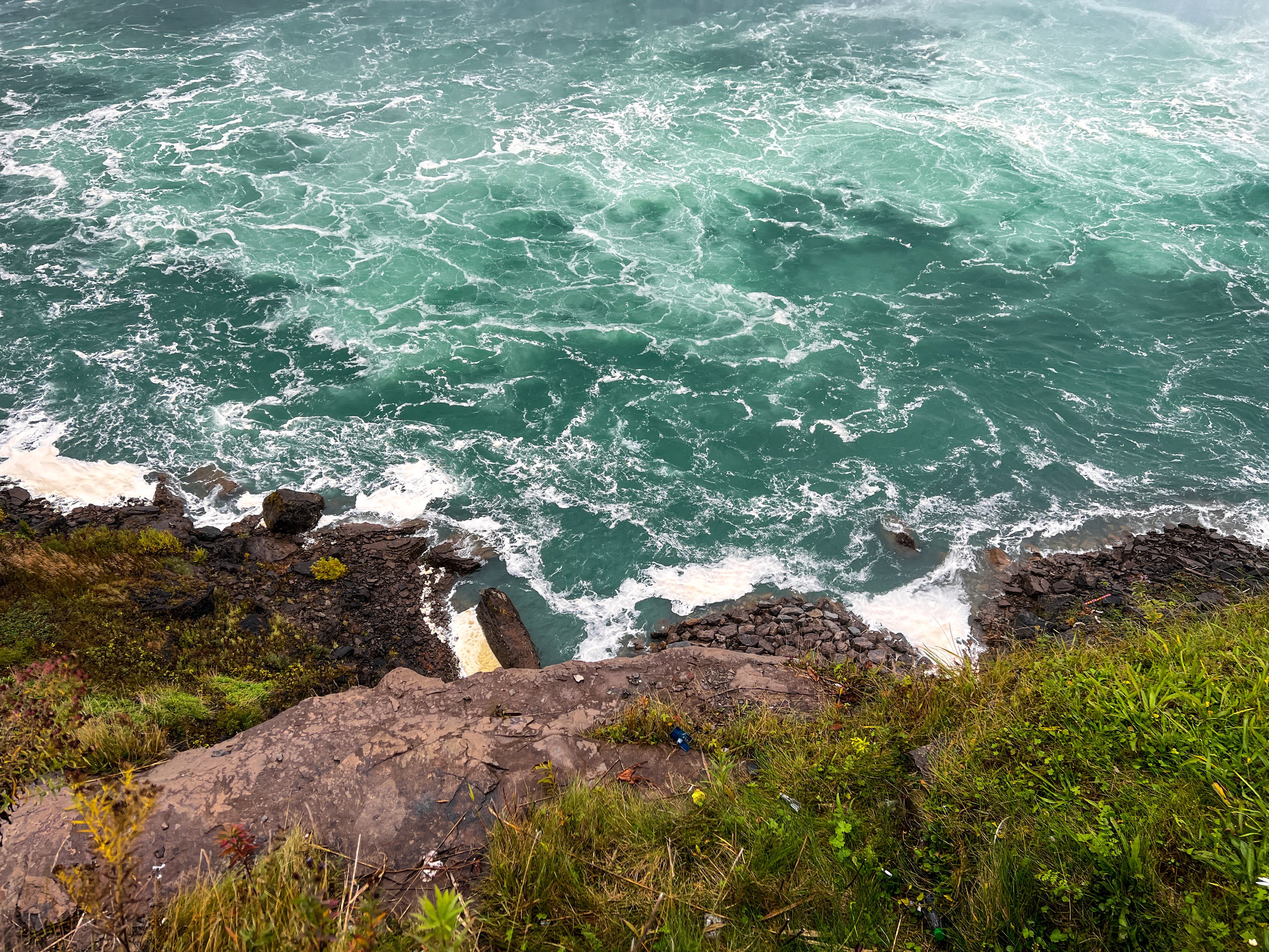 A breathtaking view of the rocky edge and turbulent waters at Niagara Falls, ON, Canada.