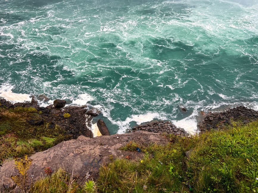 A breathtaking view of the rocky edge and turbulent waters at Niagara Falls, ON, Canada.