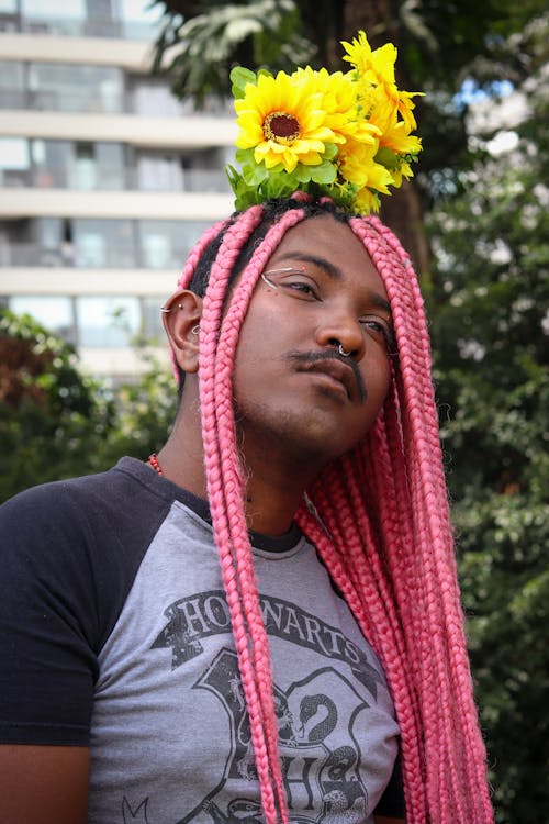 Free Man with Flower Bouquet on Head Stock Photo