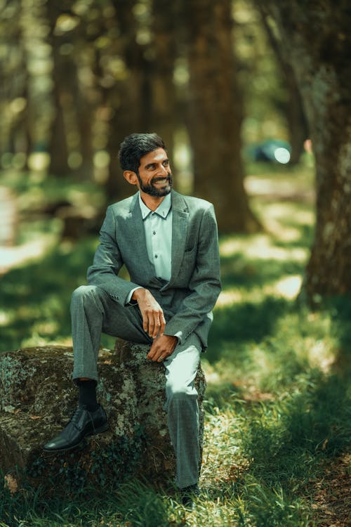 Man Sitting on a Stone