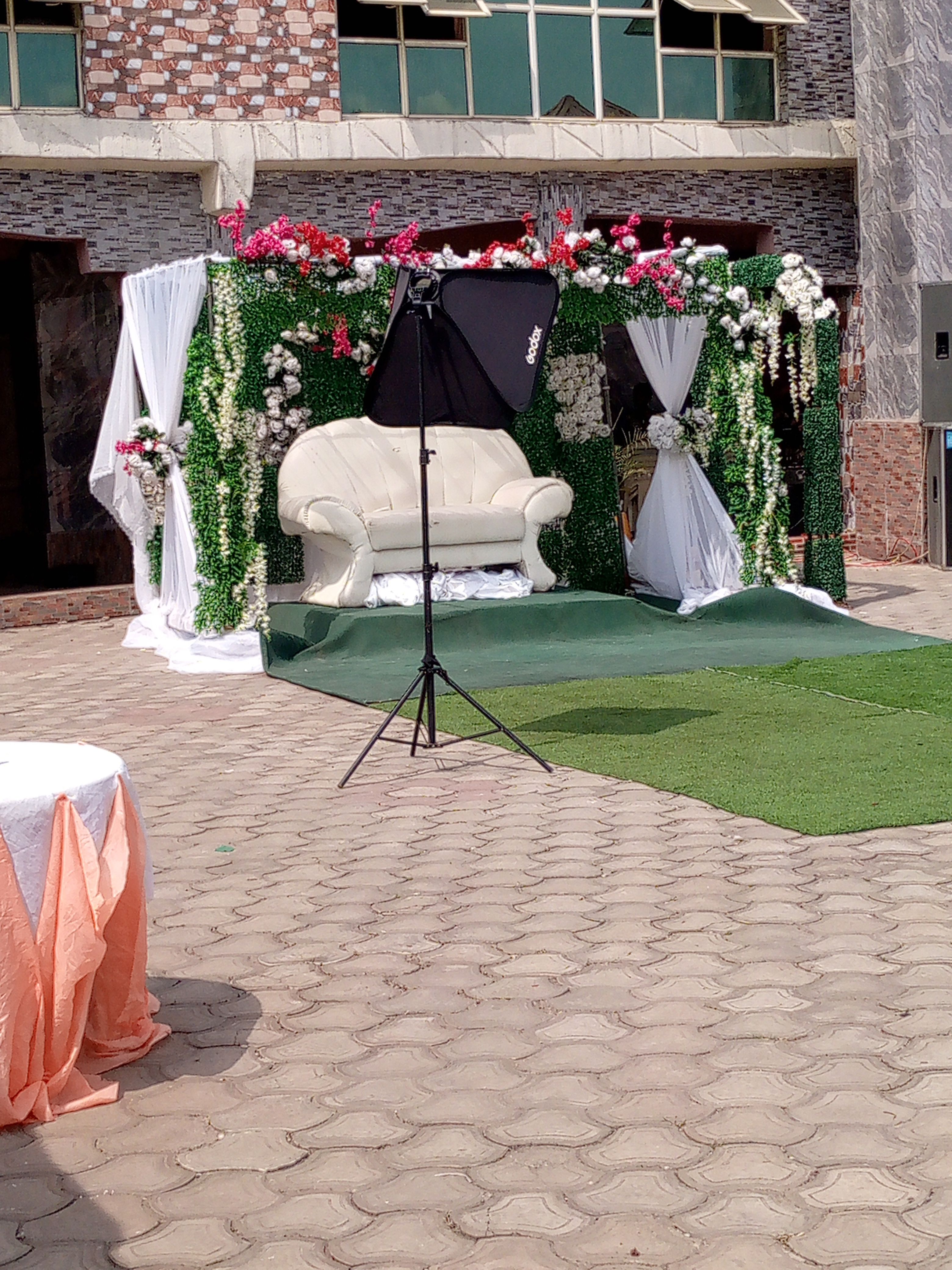 Floral arch at an outdoor wedding ceremony