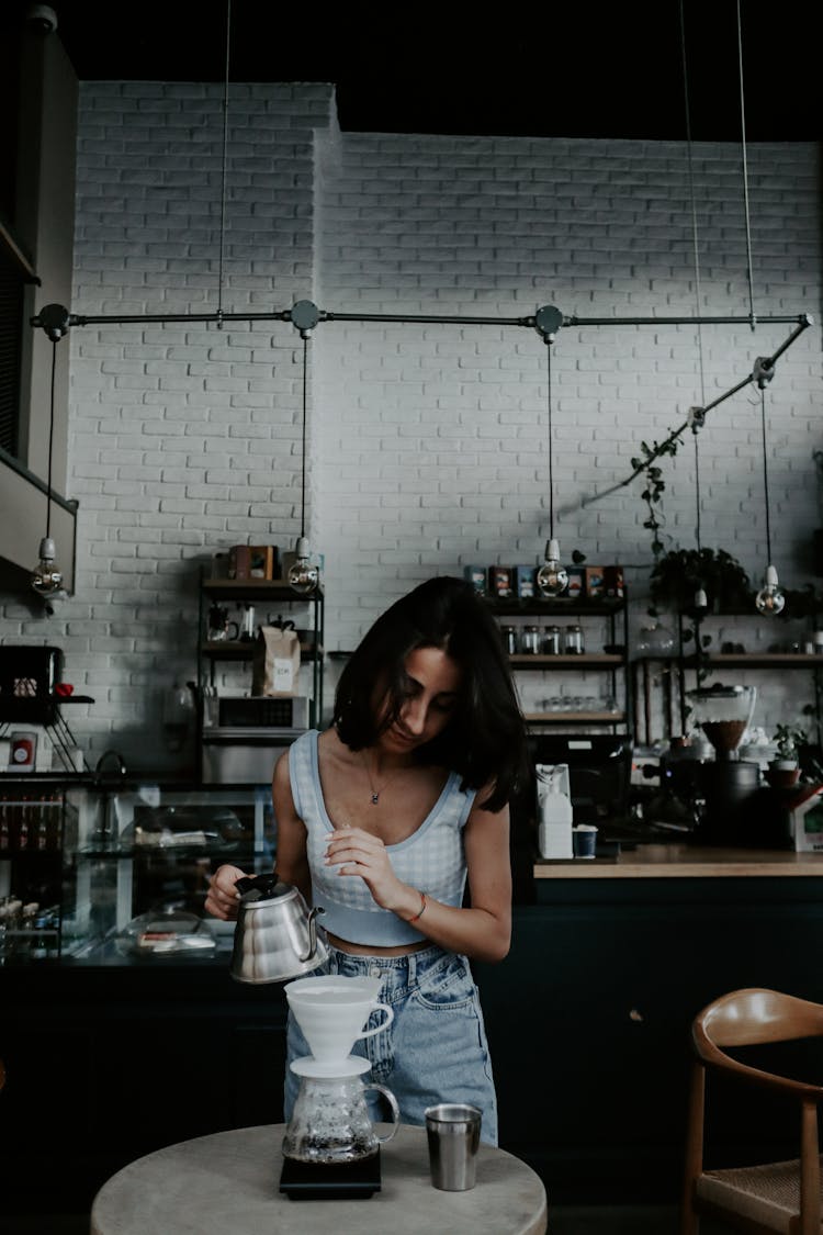 Woman Making Coffee In Kemex In Coffee Shop