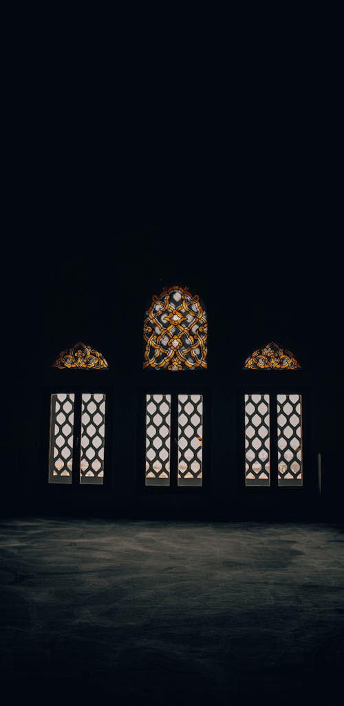 Traditional Mosque Windows in Dark Room