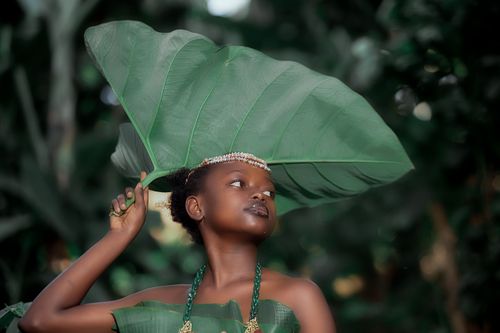 Free Creative portrait of a woman with vibrant foliage, showcasing natural beauty. Stock Photo