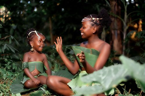 Free Two children in traditional attire enjoying happy moments outdoors. Stock Photo