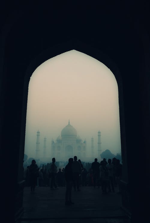 Silhouetted Crowd in front of Taj Mahal in Fog, Agra, Uttar Pradesh, India