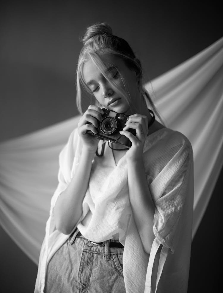 Portrait Of Woman With Camera In Black And White