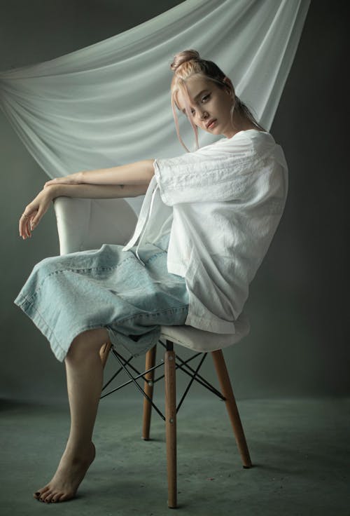 Young Woman in Casual Clothes Posing in Studio