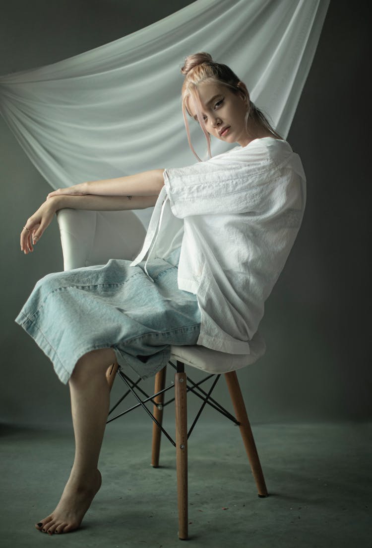 Young Woman In Casual Clothes Posing In Studio