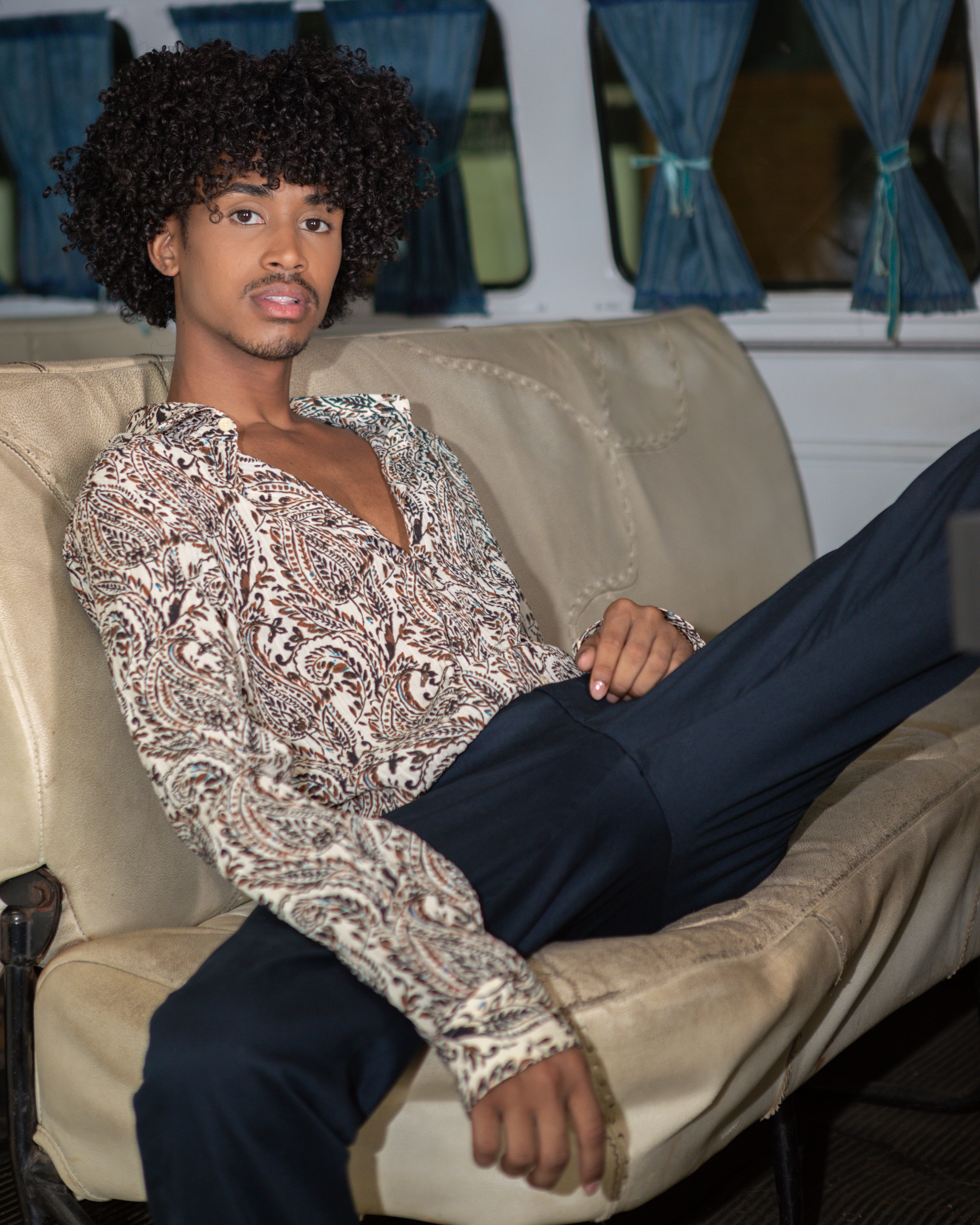 Young Man Sprawled in the Back Seat of a Van · Free Stock Photo