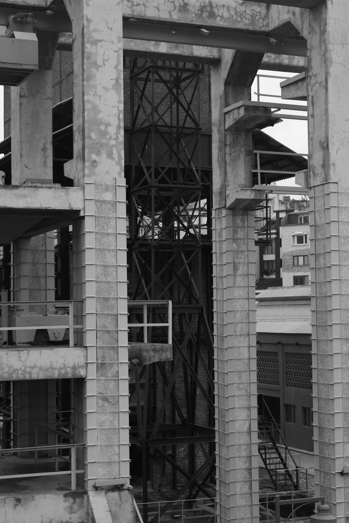 Abandoned concrete and steel building showing the kind of decaying mid-century industrial structure that defines Hashima Island