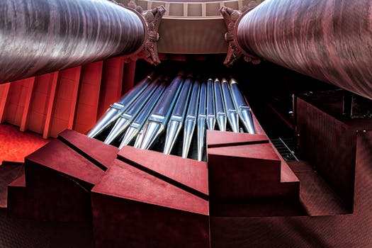 A striking view of organ pipes framed by grand columns, showcasing architectural beauty.
