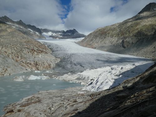 Free Panoramic view of the Rhône Glacier amidst mountains, showcasing winter's grandeur in Switzerland. Stock Photo