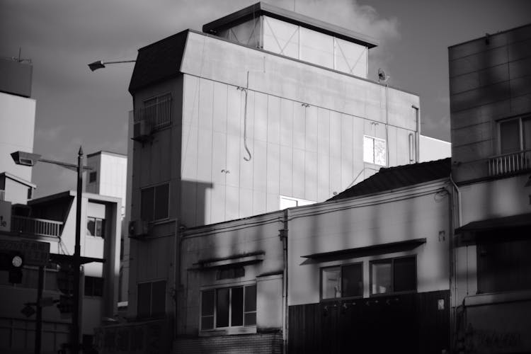 Grayscale Photo Of Concrete Buildings