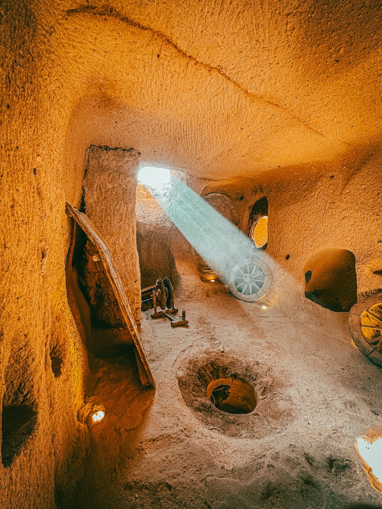 Interior Of A House Carved Into The Rock With Antique Wooden Exhibits